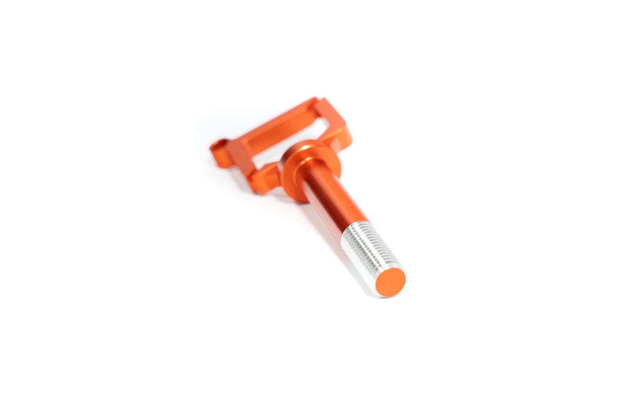An orange dipstick shown to check coolant levels